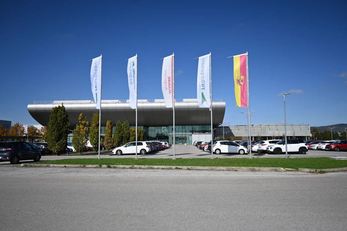 Front view of the campus building and the parking lot